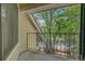 This balcony features a metal railing and a view of mature trees, perfect for a peaceful outdoor experience at 980 S Dahlia St # F, Denver, CO 80246