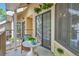 A cozy balcony seating area with a small round table, ideal for enjoying outdoor moments and sunlight at 980 S Dahlia St # F, Denver, CO 80246
