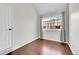 This bedroom includes hardwood floors and a window for natural lighting at 980 S Dahlia St # F, Denver, CO 80246
