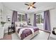 Well-decorated bedroom featuring hardwood floors, windows, and stylish furnishings at 980 S Dahlia St # F, Denver, CO 80246