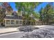 Inviting multi-level condo with classic design and mature trees offering shade and curb appeal at 980 S Dahlia St # F, Denver, CO 80246
