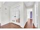 Hallway boasts hardwood floors and glass French doors providing natural light and beauty at 980 S Dahlia St # F, Denver, CO 80246