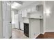 Compact kitchen with white cabinets and appliances, and tile flooring at 980 S Dahlia St # F, Denver, CO 80246