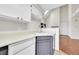 Kitchen featuring a white sink, dishwasher and faucet at 980 S Dahlia St # F, Denver, CO 80246