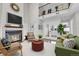 Cozy living room with a fireplace, loft, and comfortable seating at 980 S Dahlia St # F, Denver, CO 80246