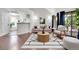 Bright living room with hardwood floors, a modern rug, and sliding glass doors at 980 S Dahlia St # F, Denver, CO 80246