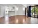 Bright living room boasts hardwood floors, large windows, and neutral tones providing a modern feel at 980 S Dahlia St # F, Denver, CO 80246