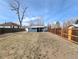 Large backyard showcasing updated fence and freshly seeded grass for a lush outdoor space at 1164 Wabash St, Denver, CO 80220