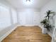 Bedroom with hardwood floors and a plant at 1164 Wabash St, Denver, CO 80220
