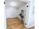 Bright bedroom with hardwood floors, a plant, and glass paneled doors at 1164 Wabash St, Denver, CO 80220