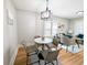 Charming dining room with modern light fixture at 1164 Wabash St, Denver, CO 80220