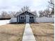 Charming home with updated fencing and walkway enhancing curb appeal and privacy at 1164 Wabash St, Denver, CO 80220