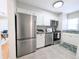 Bright kitchen with stainless steel appliances, white cabinets, and granite countertops at 1164 Wabash St, Denver, CO 80220
