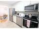 Kitchen featuring stainless appliances, granite counters, and an eat-in dining space at 1164 Wabash St, Denver, CO 80220