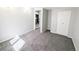 The living room features neutral colored carpet and is open to the kitchen in the adjacent room at 1164 Wabash St, Denver, CO 80220