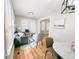 Inviting living space featuring hardwood floors, large windows, and stylish decor at 1164 Wabash St, Denver, CO 80220