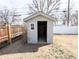 View of backyard shed framed by wood fencing, offering ample storage at 1164 Wabash St, Denver, CO 80220