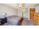 Serene bedroom with carpet, ceiling fan and view to bathroom at 5786 Biscay St, Denver, CO 80249
