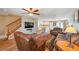 Open-concept layout with a spacious living room, hardwood floors, and seamless transition to the kitchen at 5786 Biscay St, Denver, CO 80249