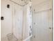 Classic bathroom features a shower-tub combination with a shower curtain and white door at 3201 S Clarkson St, Englewood, CO 80113