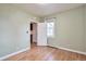 Bedroom with hardwood floors and neutral green walls at 3201 S Clarkson St, Englewood, CO 80113