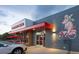 Unique building exterior with colorful mural and inviting storefront at 3201 S Clarkson St, Englewood, CO 80113