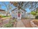 Charming single-story home with a red door, landscaped front yard, and inviting curb appeal at 3201 S Clarkson St, Englewood, CO 80113