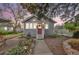 Charming single-story home with a red door, landscaped front yard, and inviting curb appeal at 3201 S Clarkson St, Englewood, CO 80113