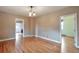 Bright living room featuring beautiful wood floors and neutral paint at 3201 S Clarkson St, Englewood, CO 80113