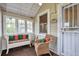 Cozy sunroom featuring wicker seating, plenty of windows, and natural light at 3201 S Clarkson St, Englewood, CO 80113