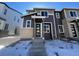 Two-story home with modern facade and snowy front yard at 22821 E Stanford Ln # B, Aurora, CO 80015