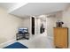 View of finished basement with neutral walls, carpeted floors, and an open floor plan with additional storage space at 7272 E Appleton Cir, Centennial, CO 80112