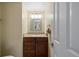 Charming half bathroom with attractive vanity and neutral color scheme at 7272 E Appleton Cir, Centennial, CO 80112