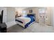 Carpeted bedroom with natural light, large windows, and closet space at 7272 E Appleton Cir, Centennial, CO 80112