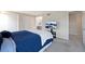 Carpeted bedroom with neutral paint and closet doors; TV on stand at 7272 E Appleton Cir, Centennial, CO 80112