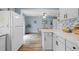 Open floor plan showing kitchen, dining room, and natural light at 7272 E Appleton Cir, Centennial, CO 80112