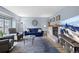 Inviting living room with a fireplace, comfortable seating, and ample natural light at 7272 E Appleton Cir, Centennial, CO 80112