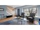 Bright living room with hardwood floors, window with view and front door at 7272 E Appleton Cir, Centennial, CO 80112