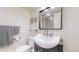 Updated bathroom with a stylish sink and dark vanity at 1029 E 8Th Ave # 501, Denver, CO 80218