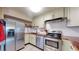 Modern kitchen with stainless steel appliances and light-colored cabinets at 1029 E 8Th Ave # 501, Denver, CO 80218