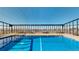 Heated rooftop pool with city views and seating area at 1029 E 8Th Ave # 501, Denver, CO 80218