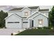 Charming two-story home with light-gray exterior, multi-car garage, and well-manicured lawn at 2500 Lupton Ln, Lafayette, CO 80026