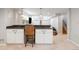 Finished basement featuring a bar area with pendant lighting and ample seating at 1055 S Clayton Way, Denver, CO 80209
