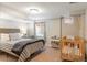 Basement bedroom featuring a bed, crib and window for natural light at 1055 S Clayton Way, Denver, CO 80209