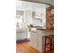 Bright, modern kitchen featuring white cabinets, marble countertops, subway tile backsplash, and stainless steel appliances at 1055 S Clayton Way, Denver, CO 80209
