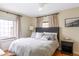 Spacious main bedroom with hardwood floors, neutral tones and natural light at 1055 S Clayton Way, Denver, CO 80209