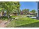 Spacious backyard featuring a play structure, a patio, and a rock garden at 9929 W Fairview Ave, Littleton, CO 80127