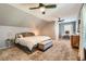 Serene bedroom boasts vaulted ceilings, soft carpet, and a cozy decor at 9929 W Fairview Ave, Littleton, CO 80127