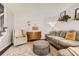 Inviting living room with neutral tones, comfortable seating, and stylish decor creates a relaxing space at 9929 W Fairview Ave, Littleton, CO 80127