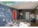 Back porch area with a red door and convenient access to the house at 2865 Newland St, Wheat Ridge, CO 80214